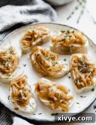 Sweet Caramelized Onion and Tangy Goat Cheese Crostini 7 A plate with caramelized onion topped goat cheese crostini.