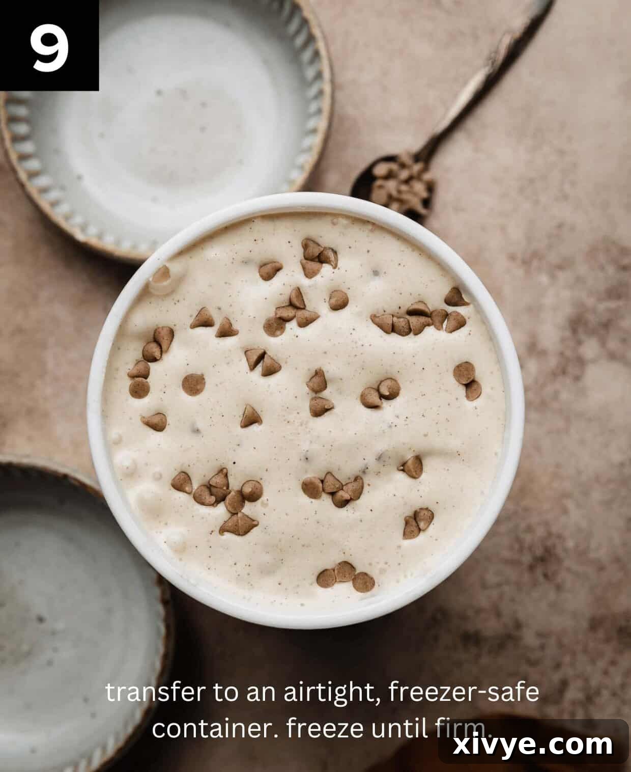 Spiced Cinnamon Delight 6 Overhead photo of cinnamon chip ice cream in a round freezer-safe ice cream container on a light brown textured background.