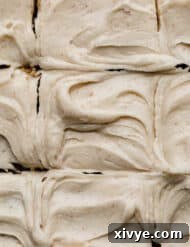 Swirled Brown Butter Cream Cheese Frosting with small brown specks throughout the frosting.