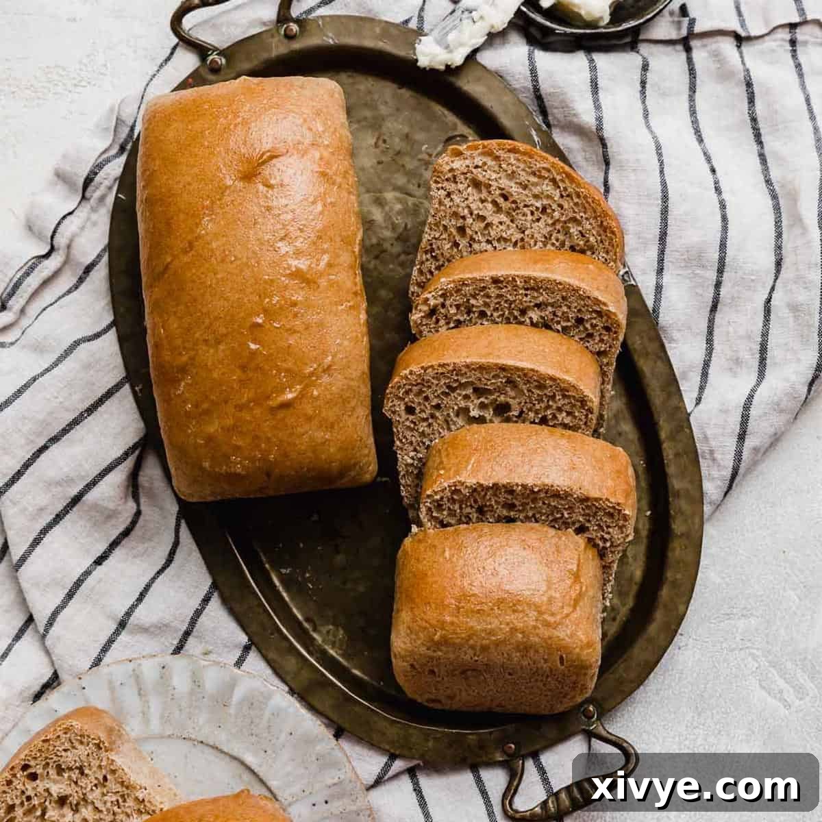 Fifty-Fifty White and Whole Wheat Bread 13 Two loaves of mini 50/50 bread on a gold tray.