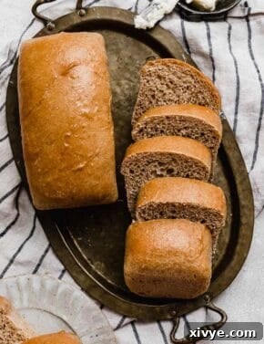 Fifty-Fifty White and Whole Wheat Bread 16 Two loaves of mini 50/50 bread on a gold tray.