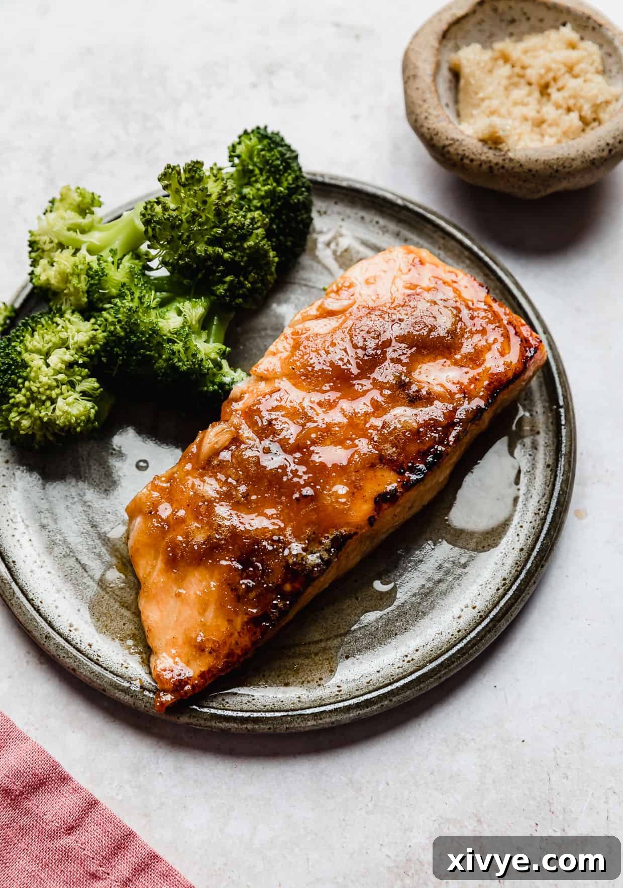 Brown Sugar Crusted Salmon and broccoli on a grey plate, ready to be served.