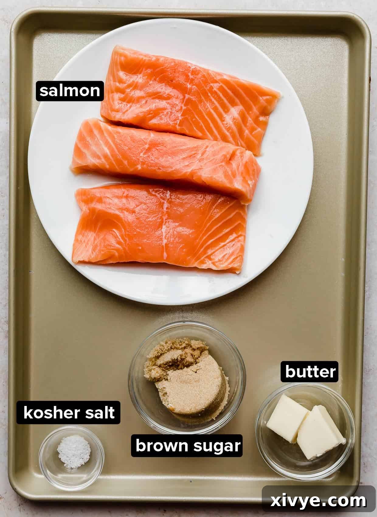 Brown Sugar Salmon ingredients laid out on a bronze baking sheet.