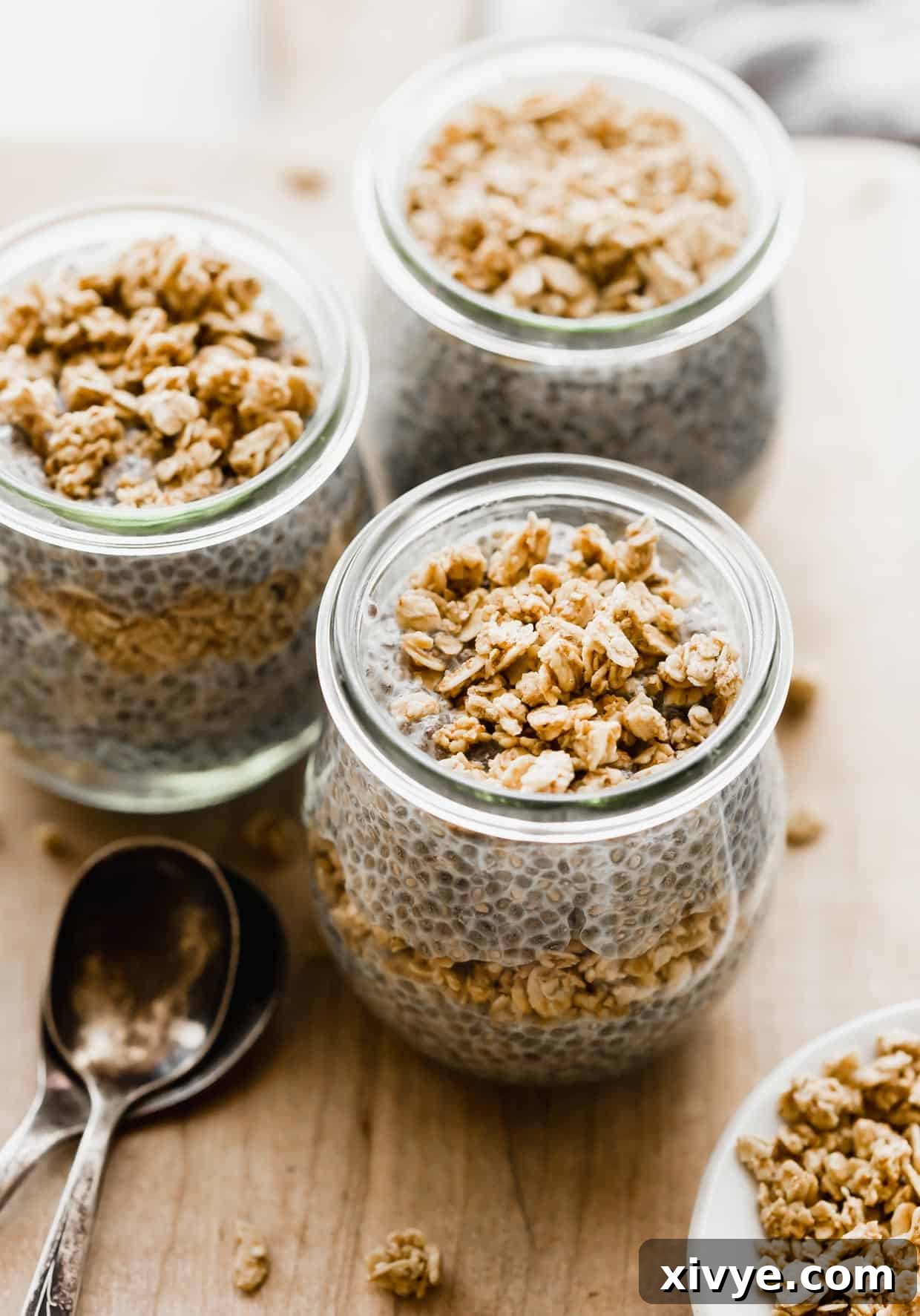 Overnight Oat Milk Chia Pudding 2 Chia Pudding with Oat Milk in a glass jar and topped with granola.