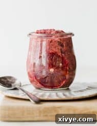 Vibrant Blood Orange Chia Delight 5 A glass jar filled with vibrant Blood Orange Chia Pudding