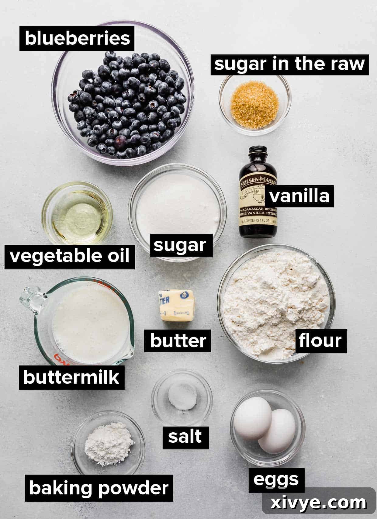 Sunrise Buttermilk Blueberry Muffins 3 A collage of fresh ingredients laid out for making moist buttermilk blueberry muffins, including blueberries, buttermilk, flour, and sugar.