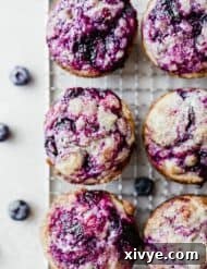 Overhead photo of easy to make blueberry muffins, golden brown and glistening.