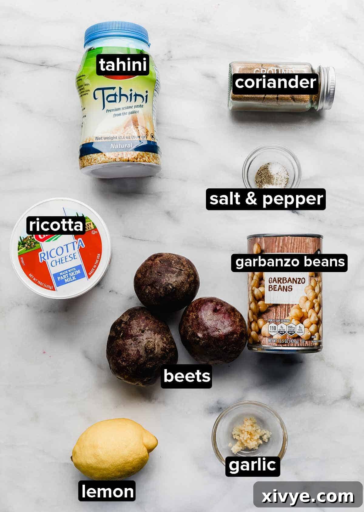 Beet Hummus with ricotta ingredients on a white background.