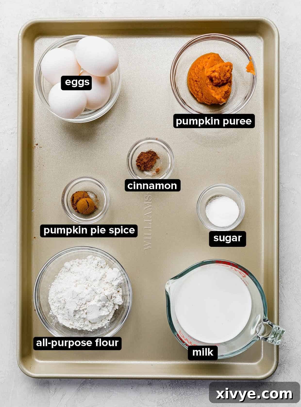 Golden Pumpkin Crepes 3 Pumpkin Crepes ingredients portioned into glass bowls, on a gold baking sheet.