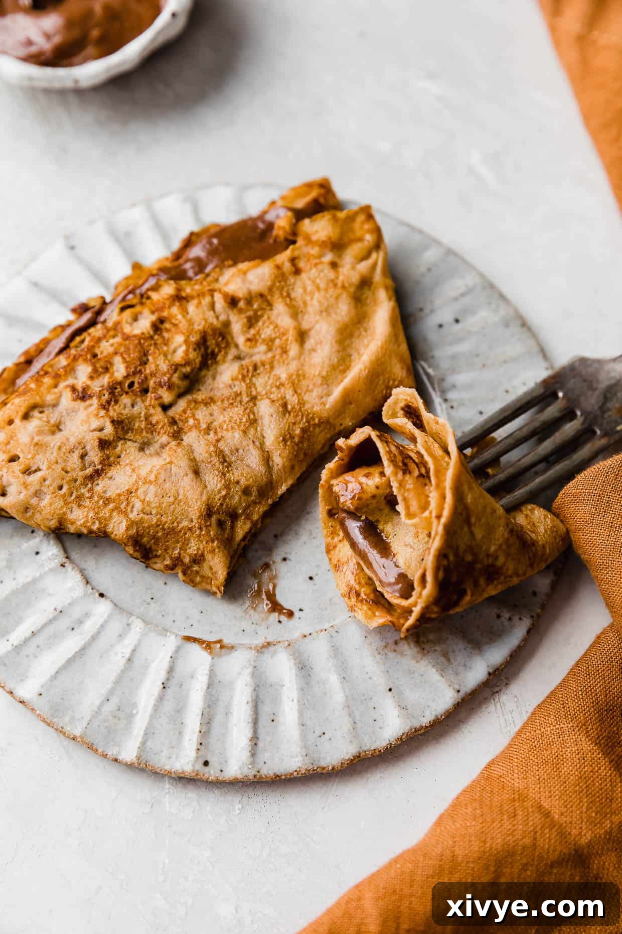 Golden Pumpkin Crepes 7 A Pumpkin Crepe filled with nutella whipped cream, cut into.