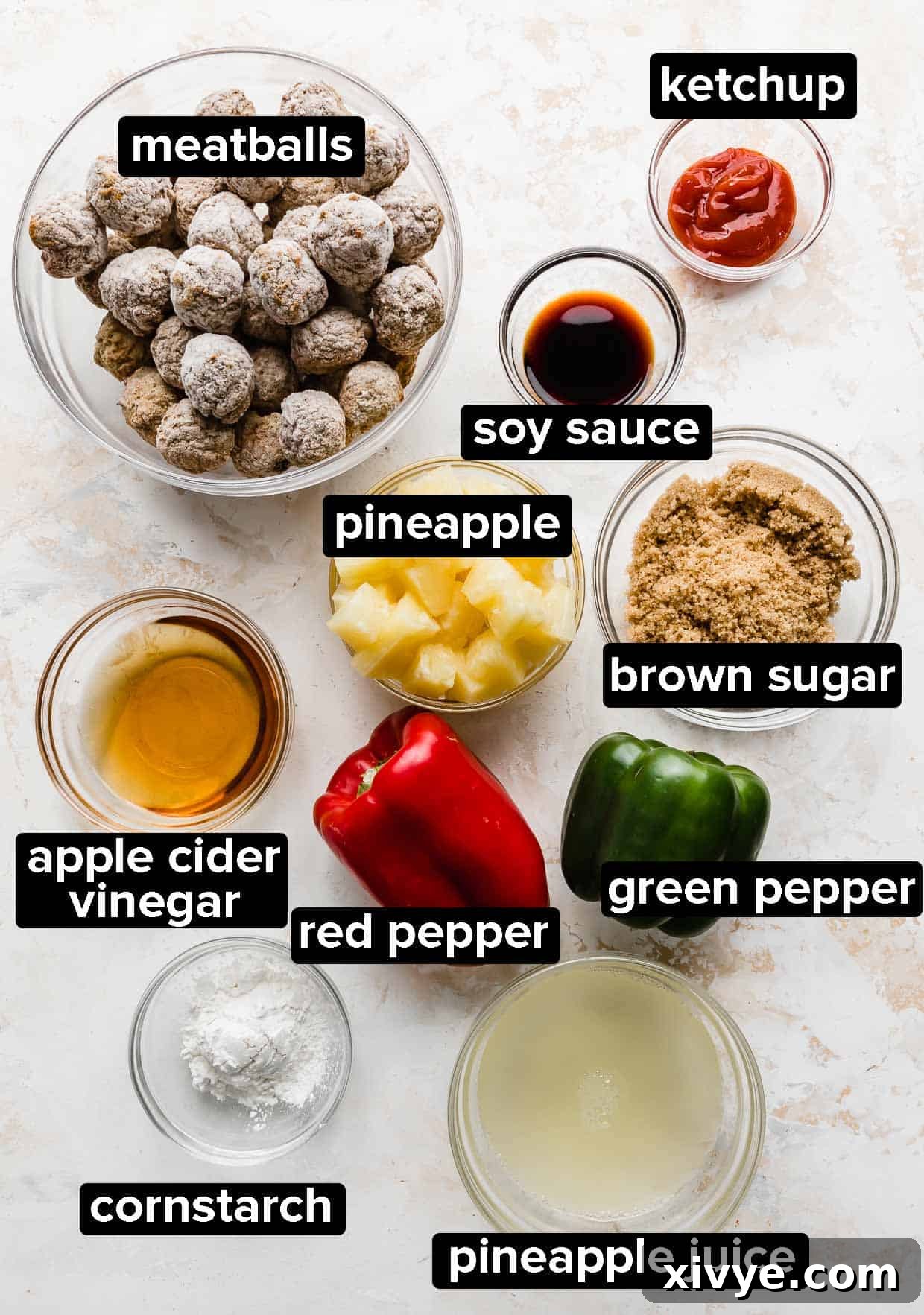 Delectable Sweet and Sour Slow Cooker Meatballs 4 A colorful array of ingredients artfully arranged on a cutting board, ready to be used for making slow cooker sweet and sour meatballs, including frozen meatballs, canned pineapple, bell peppers, and various sauce components.