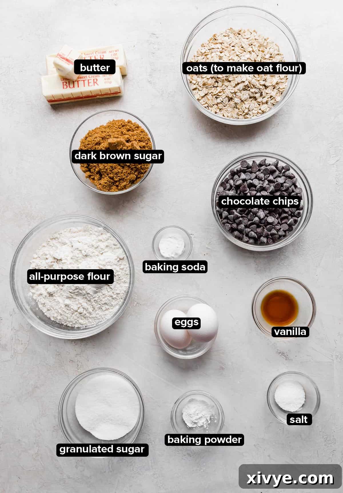 Caramelized Butter Chocolate Chip Cookies 3 A vibrant flat lay arrangement of Brown Butter Chocolate Chip Cookie ingredients on a stylish gray background, ready for baking.