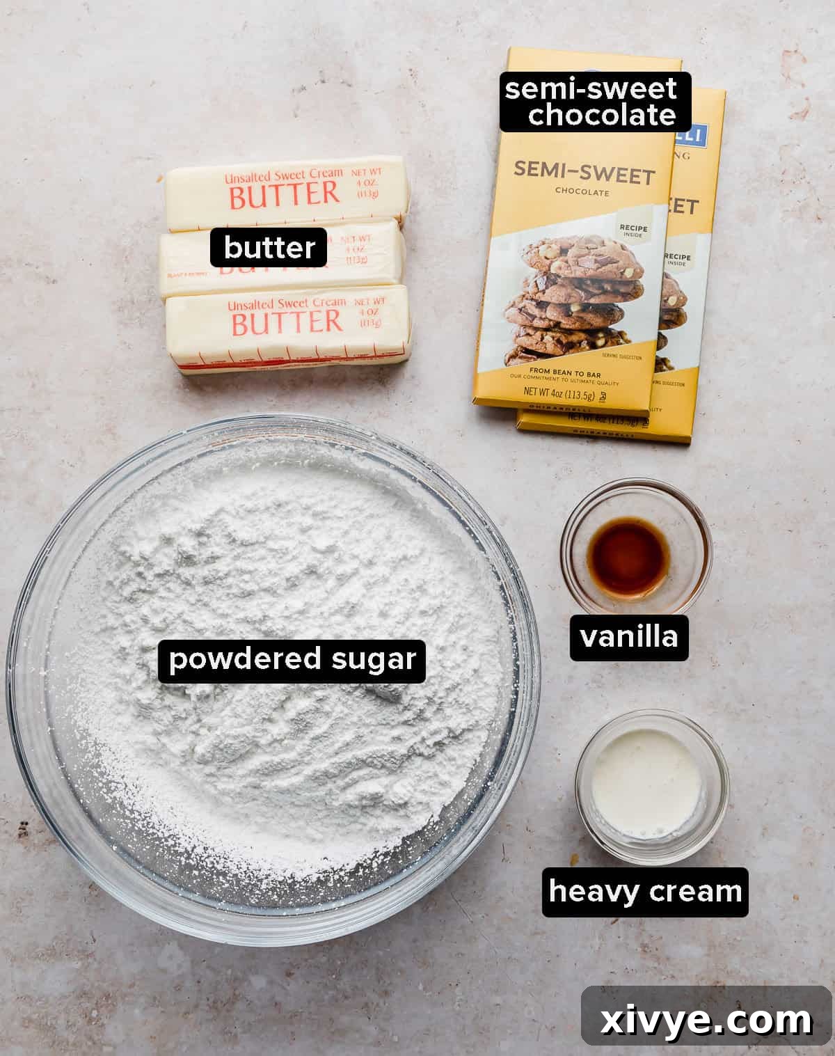 Decadent Chocolate Buttercream 3 Ingredients used to make chocolate buttercream frosting, laid out on a clean surface.