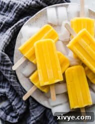 A pile of pineapple mango popsicles.