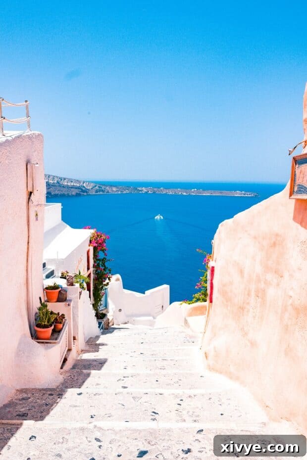 A stunning panoramic photo of Santorini, Greece, showcasing its iconic whitewashed buildings with blue domes, perched on cliffs overlooking the bright blue ocean.