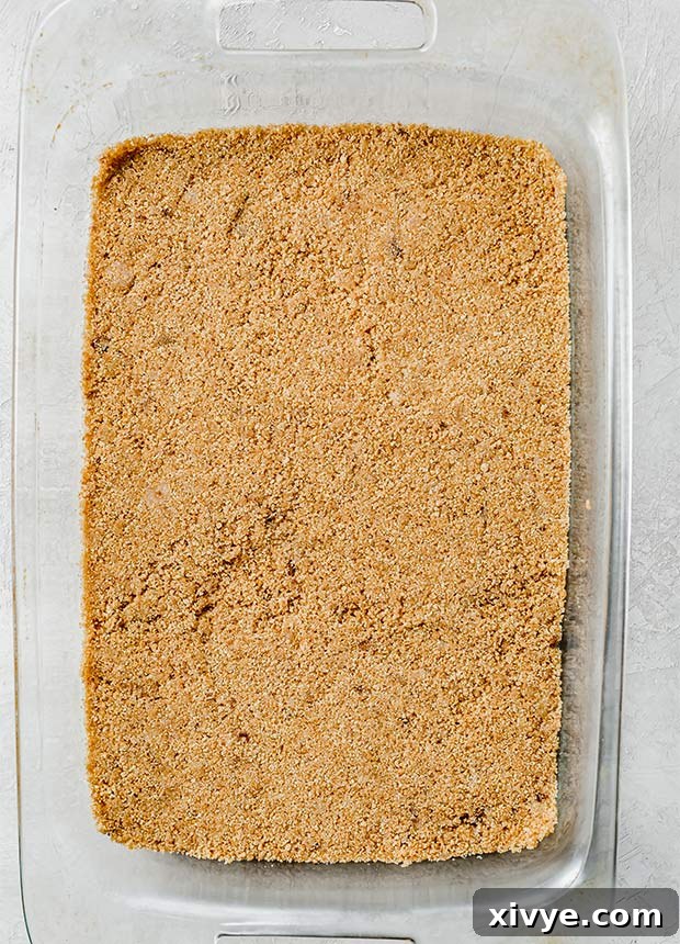 Sun-Kissed Peach Indulgence 5 A 13" x 9" pan with a golden-brown graham cracker crust on the bottom, chilled and ready.