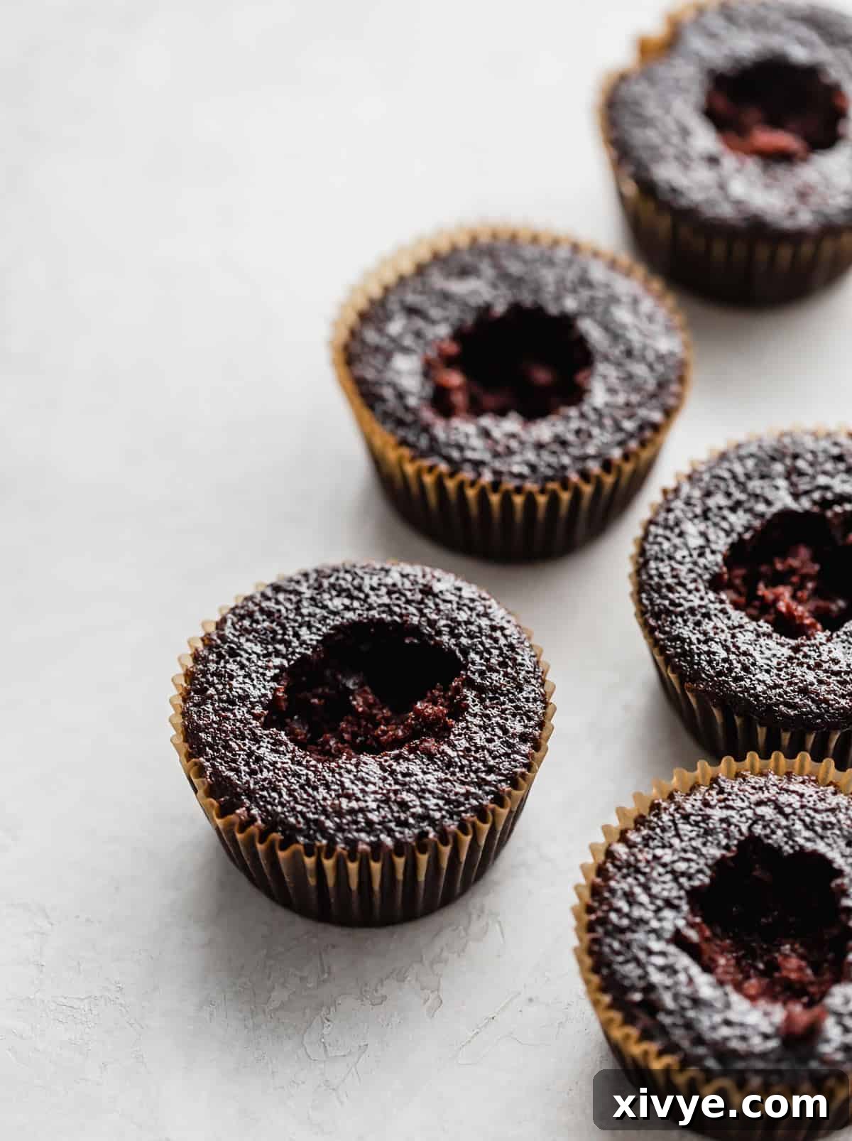 Chocolate Cupcakes with the core of the cupcake removed, creating a perfect cavity for filling.