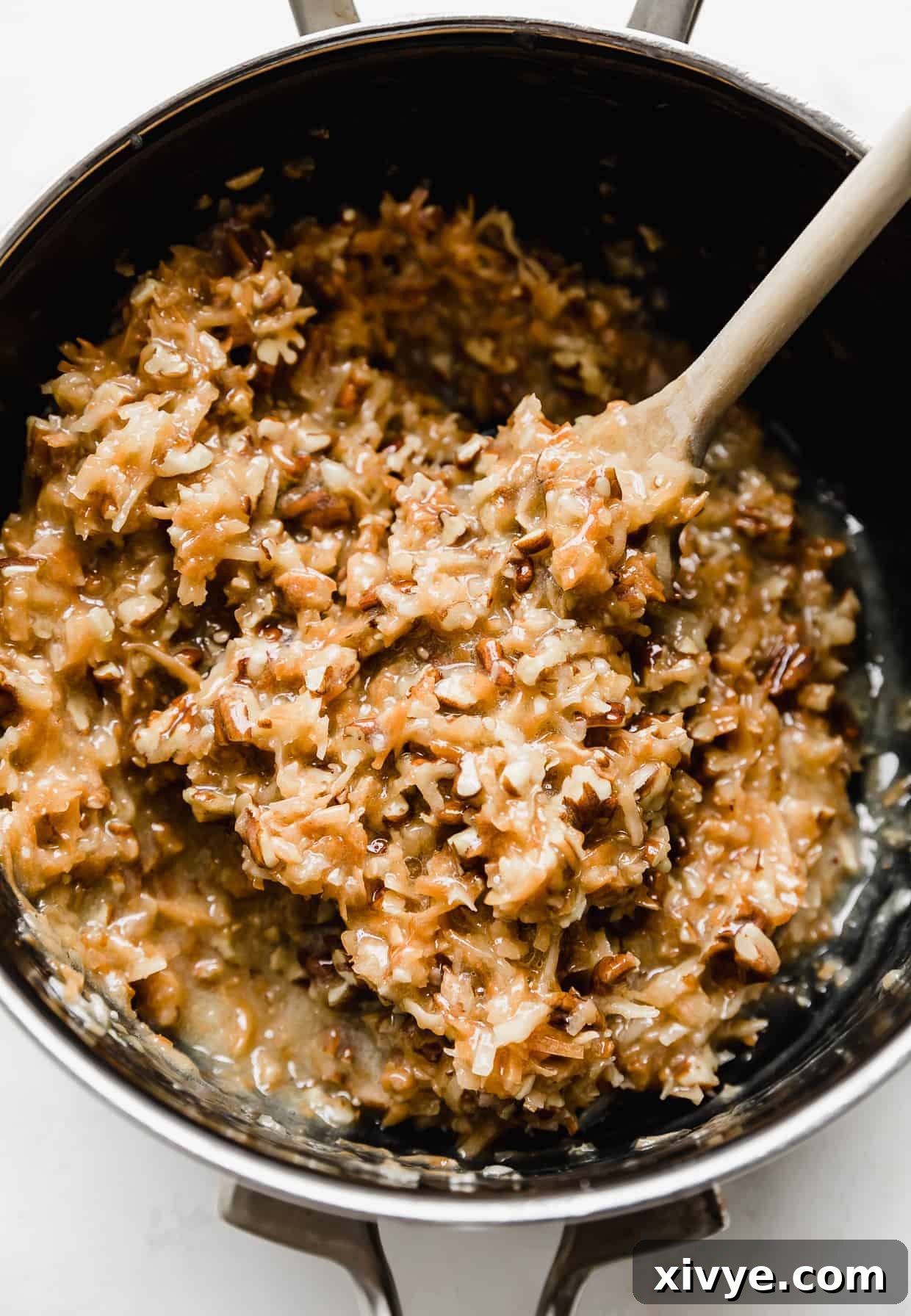 A saucepan with fresh made German Chocolate Cake Frosting in it, displaying its rich, thick texture.