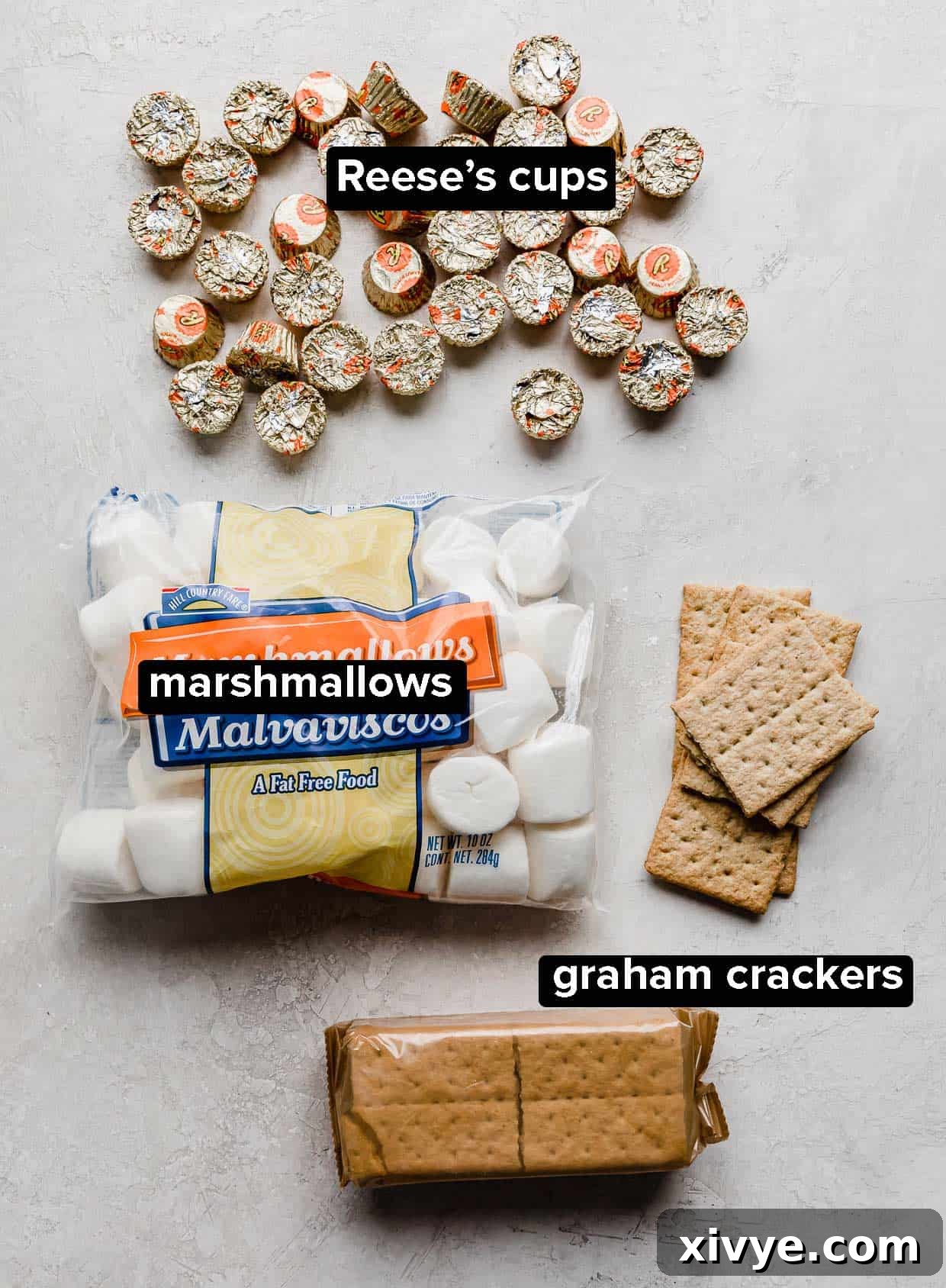 Ingredients used to make Reese's S'mores on a white background.