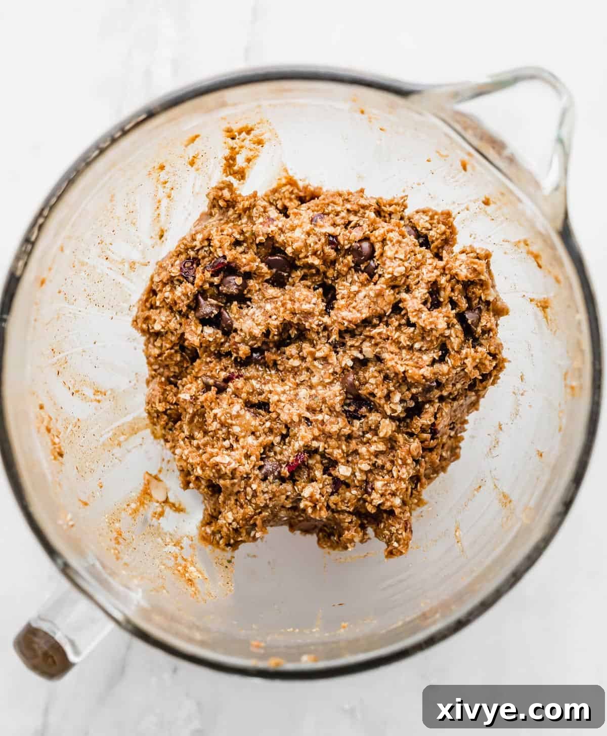 Healthy Breakfast Cookie dough balls on a parchment lined baking sheet.