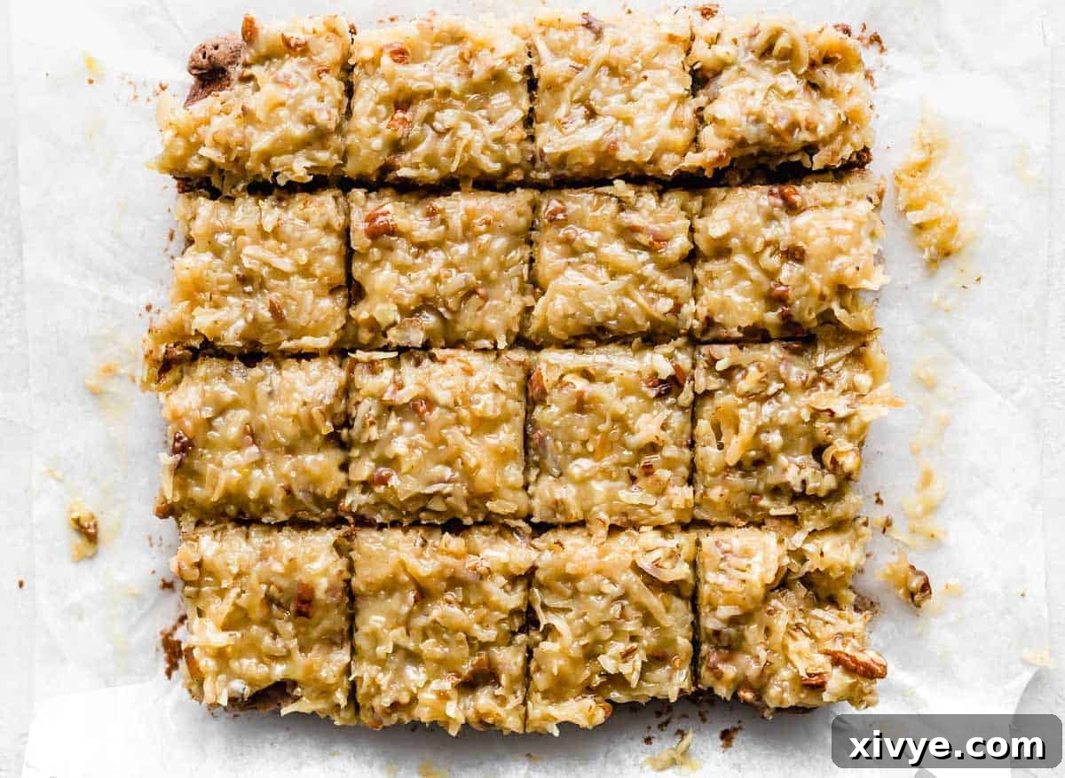 Coconut pecan frosting topped German Chocolate Brownies cut into 16 squares.