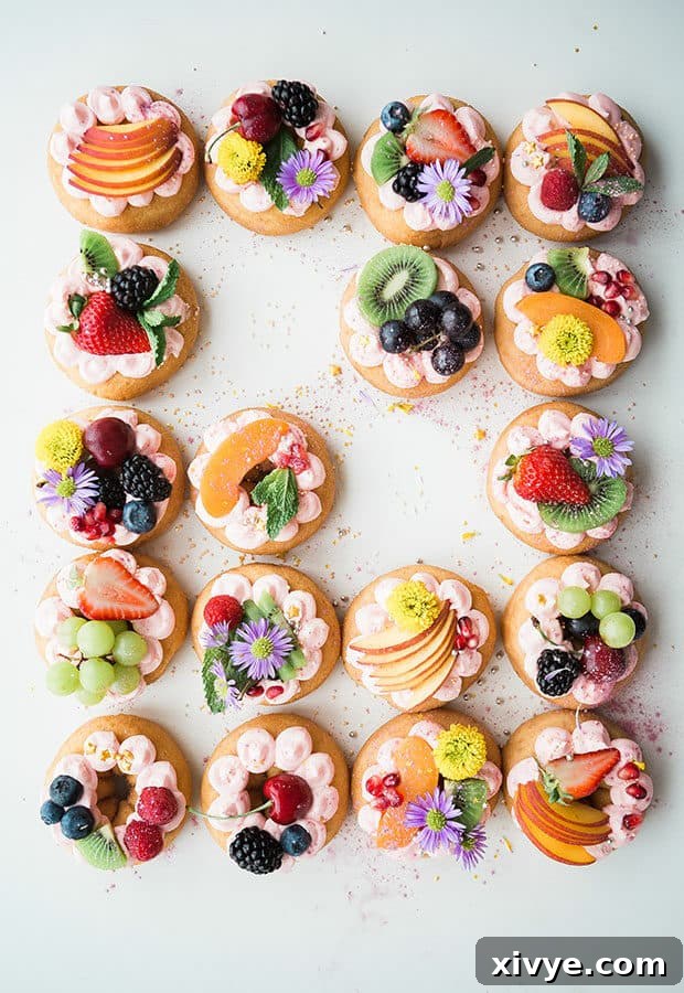 Donuts covered with fruits and flowers.