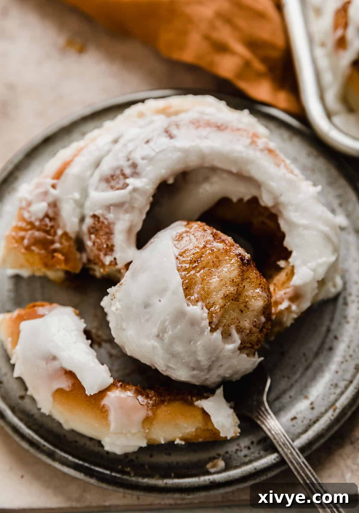 Easy homemade cinnamon roll on a gray plate.