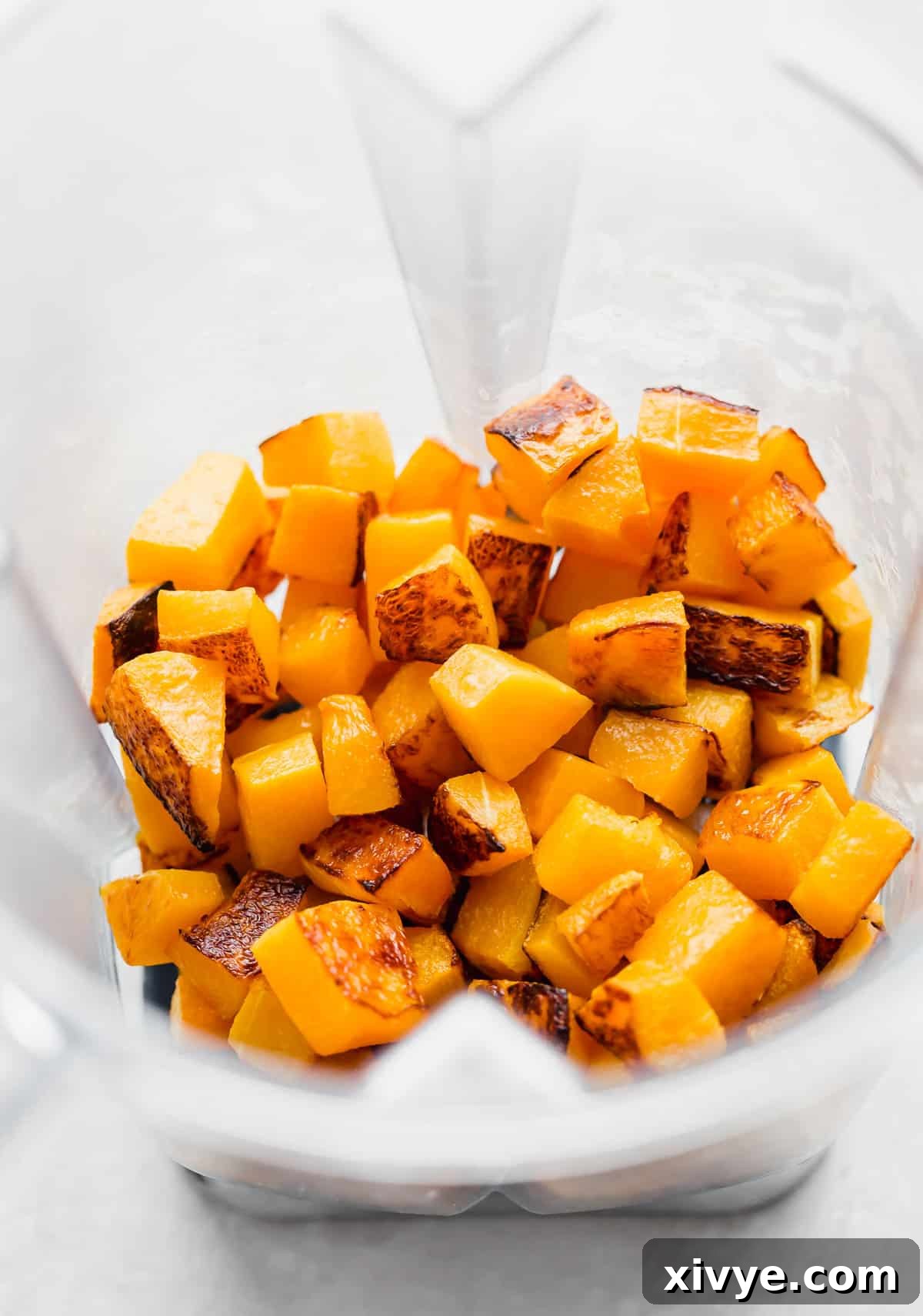 Perfectly roasted butternut squash cubes ready to be pureed, placed in a blender for the creamy pasta sauce.