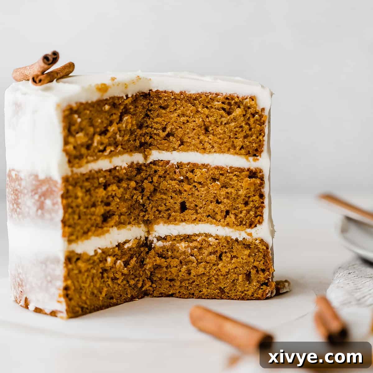A beautifully frosted Pumpkin layered cake with cream cheese frosting, perfect for any fall celebration.