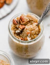 Spiced Pumpkin Rice Pudding 12 Pumpkin Rice Pudding in a glass jar on a white background.