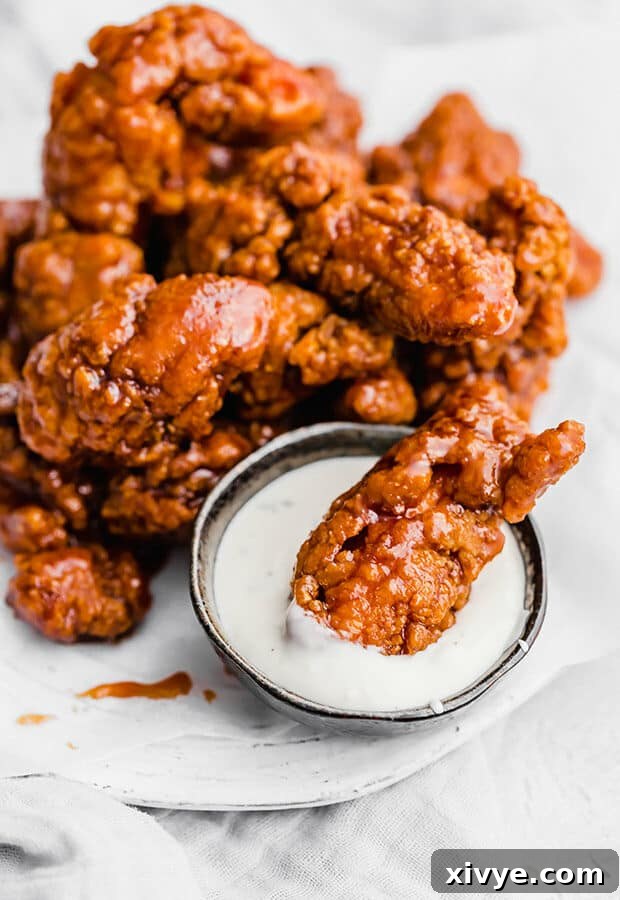 The Fingerprint Wingery 7 A Wingers Sticky Finger dipped into ranch dressing.