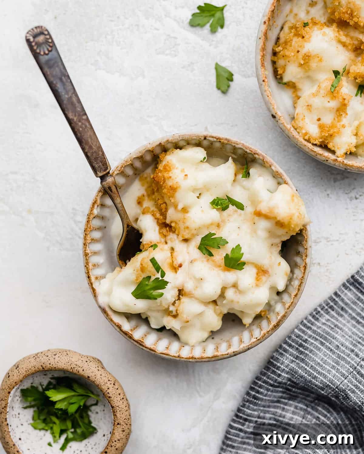 Parsley garnished Cauliflower Gratin in a bowl.