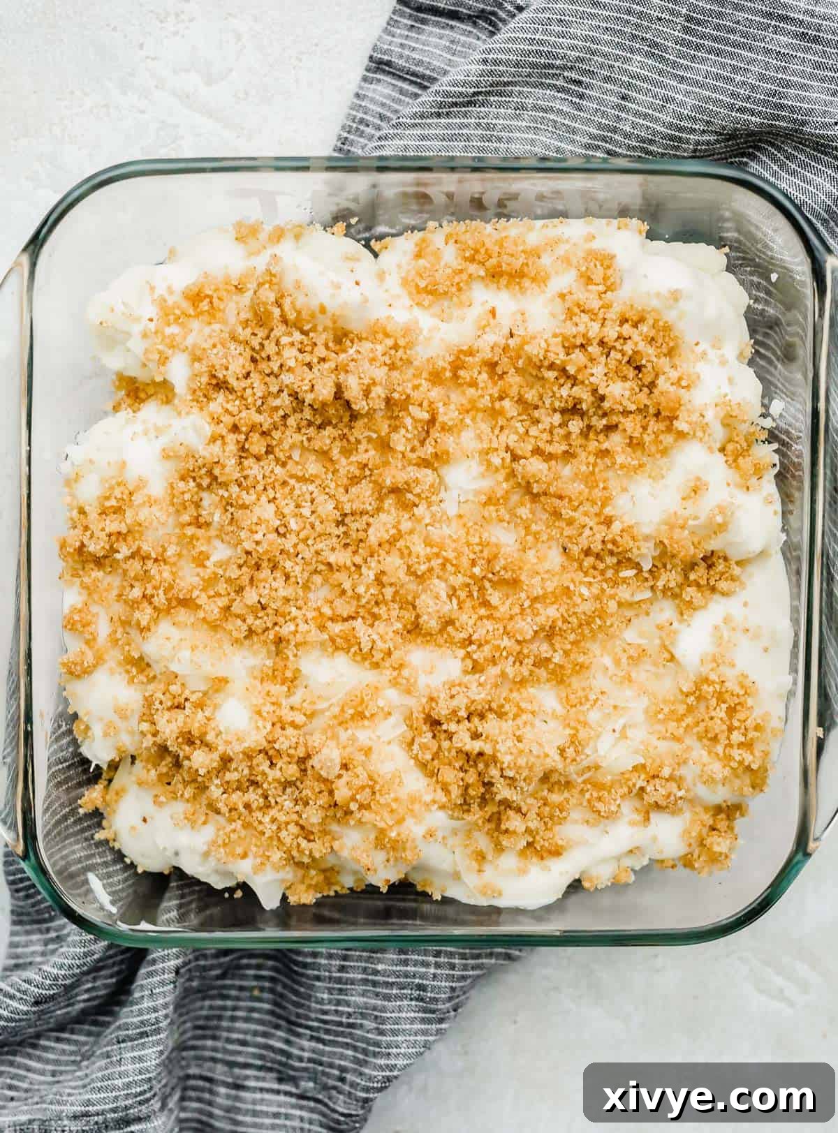 Breadcrumb topped Cauliflower Gratin in a square baking dish.