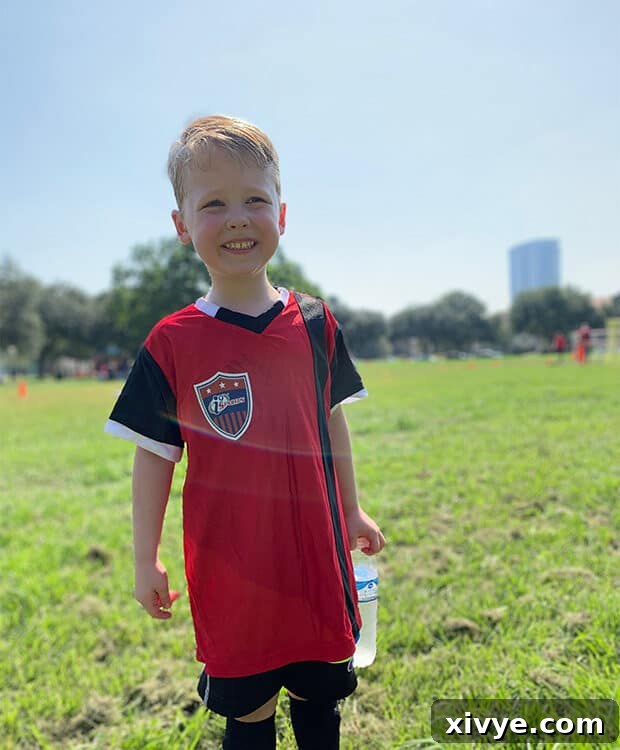 Midweek Bliss 2 A candid shot of a child playing youth soccer on a sunny day, showcasing the excitement and energy of the game.