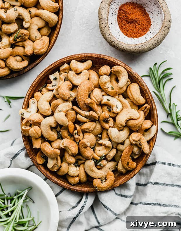 A plate full of Rosemary Roasted Cashews, perfectly golden and glistening.