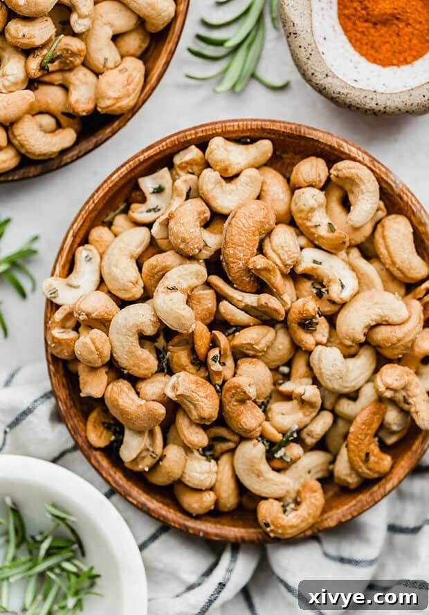 Rosemary roasted cashews on a plate, ready to be enjoyed.