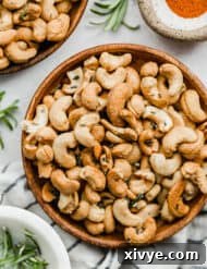 Rosemary roasted cashews on a plate.
