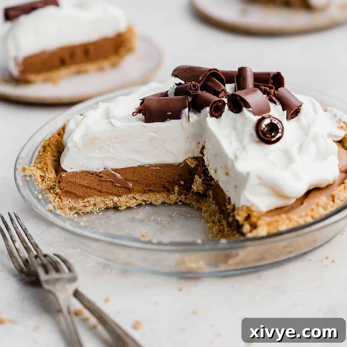 Graham Cracker Crumble Base 5 A French Silk Pie on a graham cracker crust with a slice removed from the full pie.