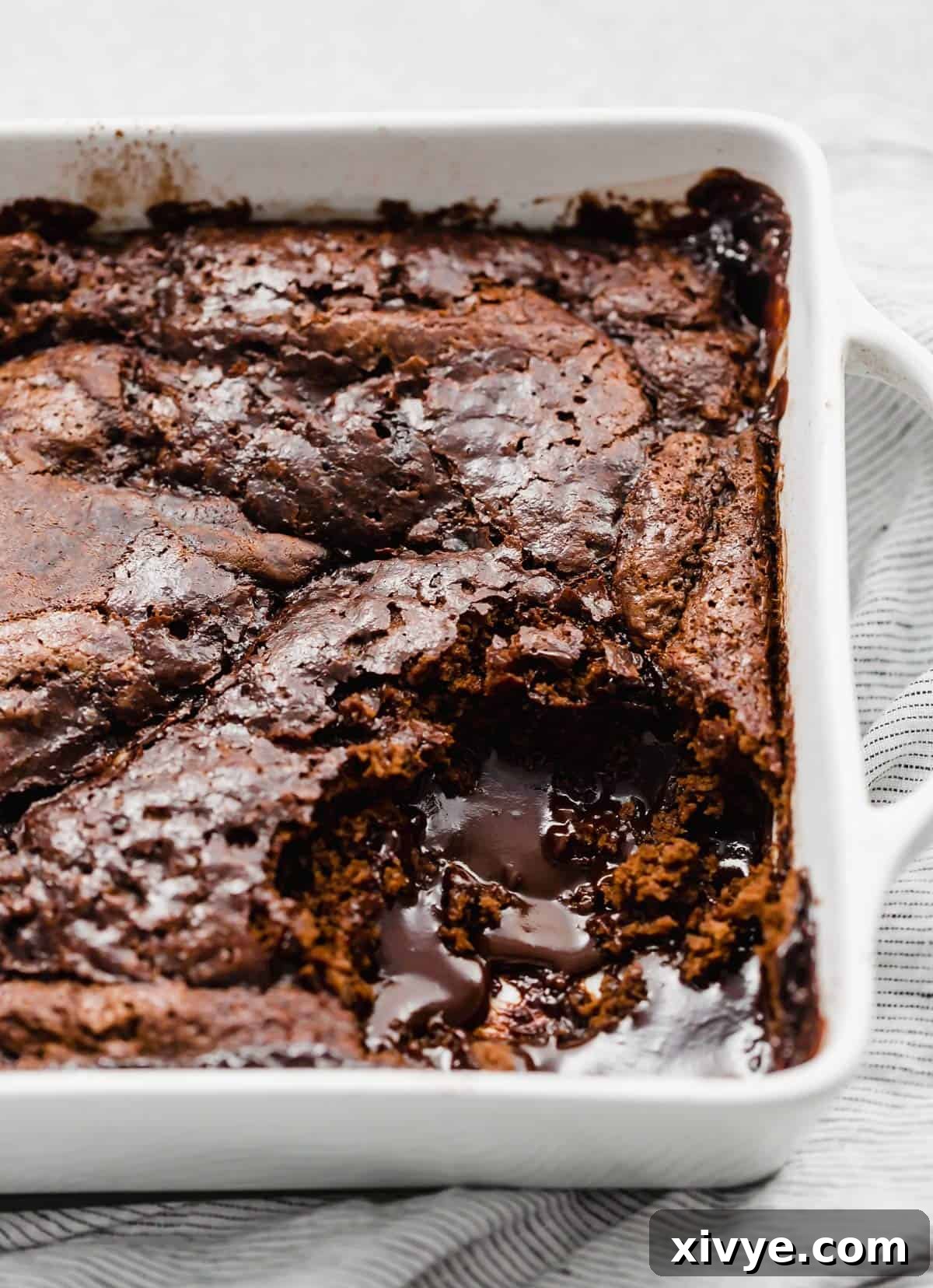 Molten Chocolate Dream 2 A square white dish with hot fudge cake in it.