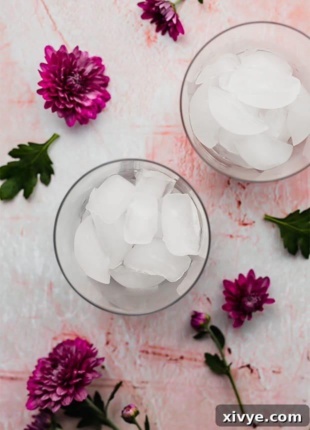 An overhead photo of a glass cup full of sparkling ice cubes, perfectly clear and ready for the soda creation.