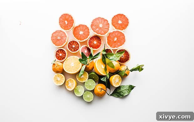 Photo by Brooke Lark, a vibrant arrangement of citrus fruits with surrounding greenery, evoking freshness and zest.