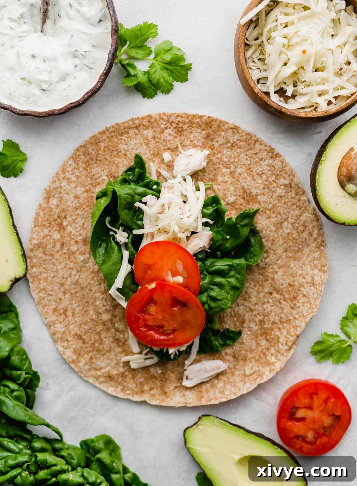 Lean and Green Chicken Wraps 5 A whole wheat tortilla topped with rotisserie chicken, spinach, and sliced tomatoes.