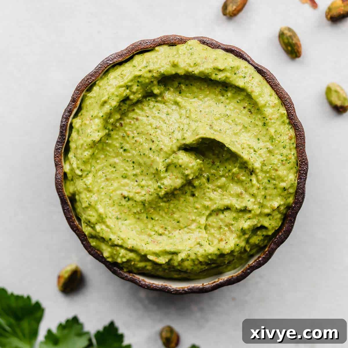A black rimmed bowl filled with a vibrant Green Sauce Recipe in it.
