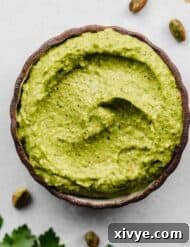 A black rimmed bowl filled with a vibrant Green Sauce Recipe in it.