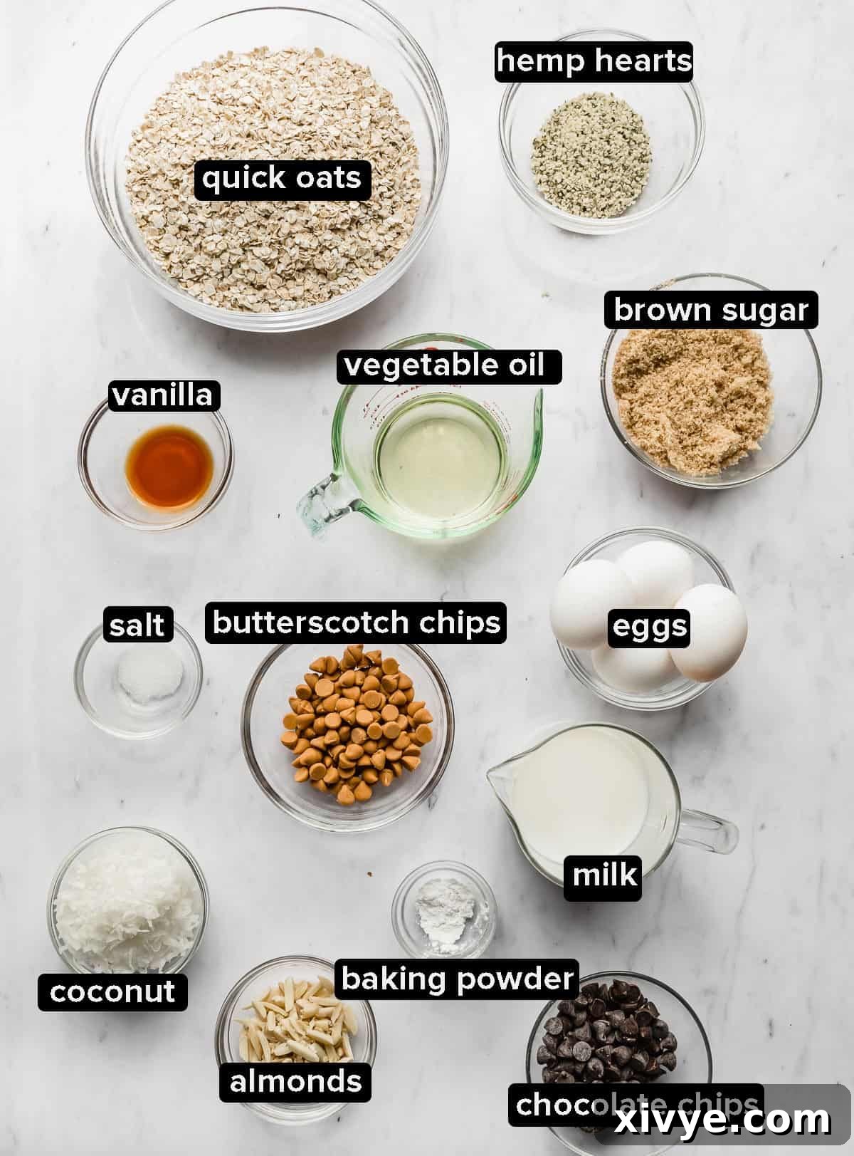 Baked oatmeal cake ingredients portioned into glass bowls on a white background, highlighting the freshness and quality of each component.
