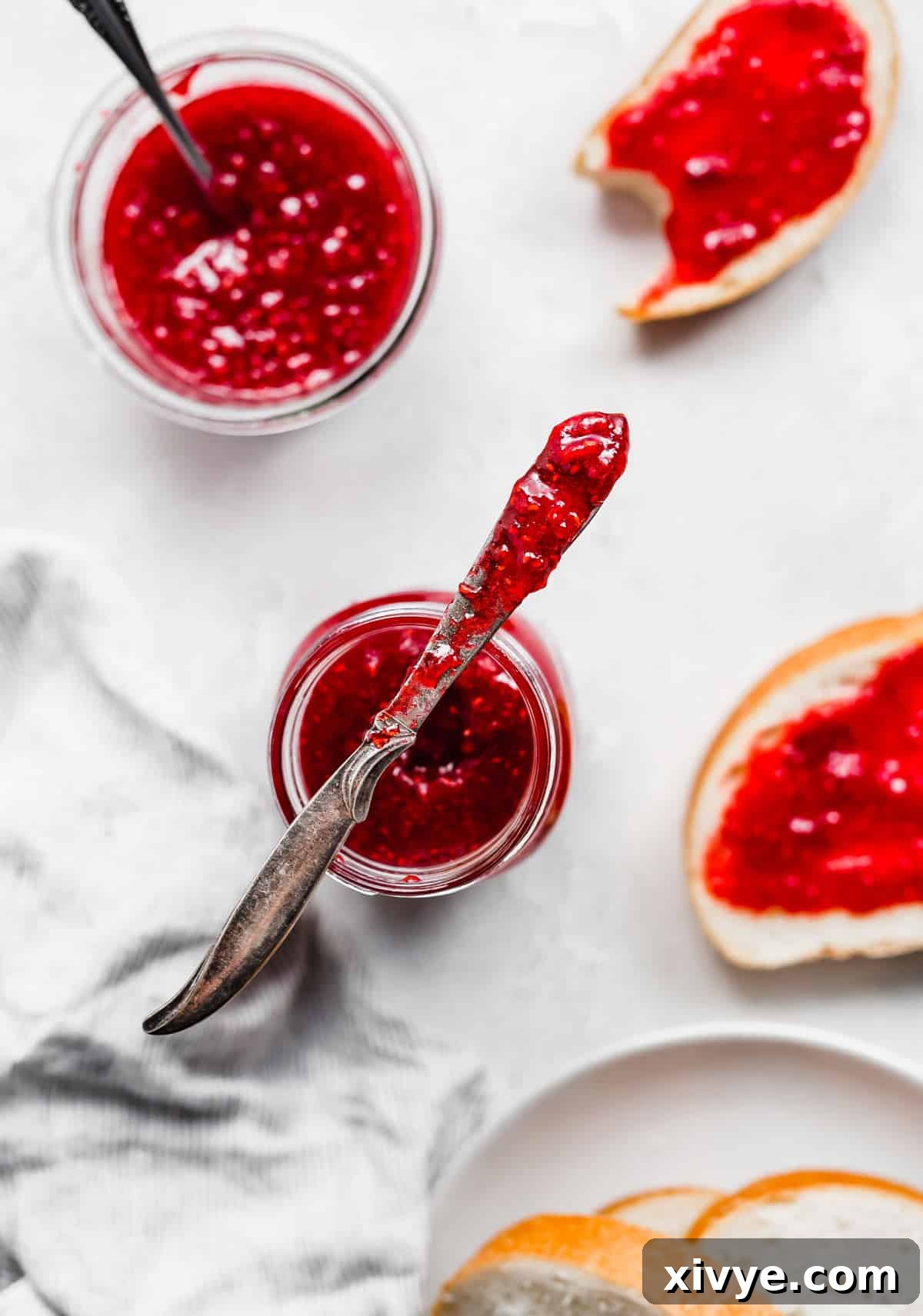 No-Fuss Raspberry Freezer Jam 9 Overhead photo of Raspberry Freezer Jam with sliced bread.