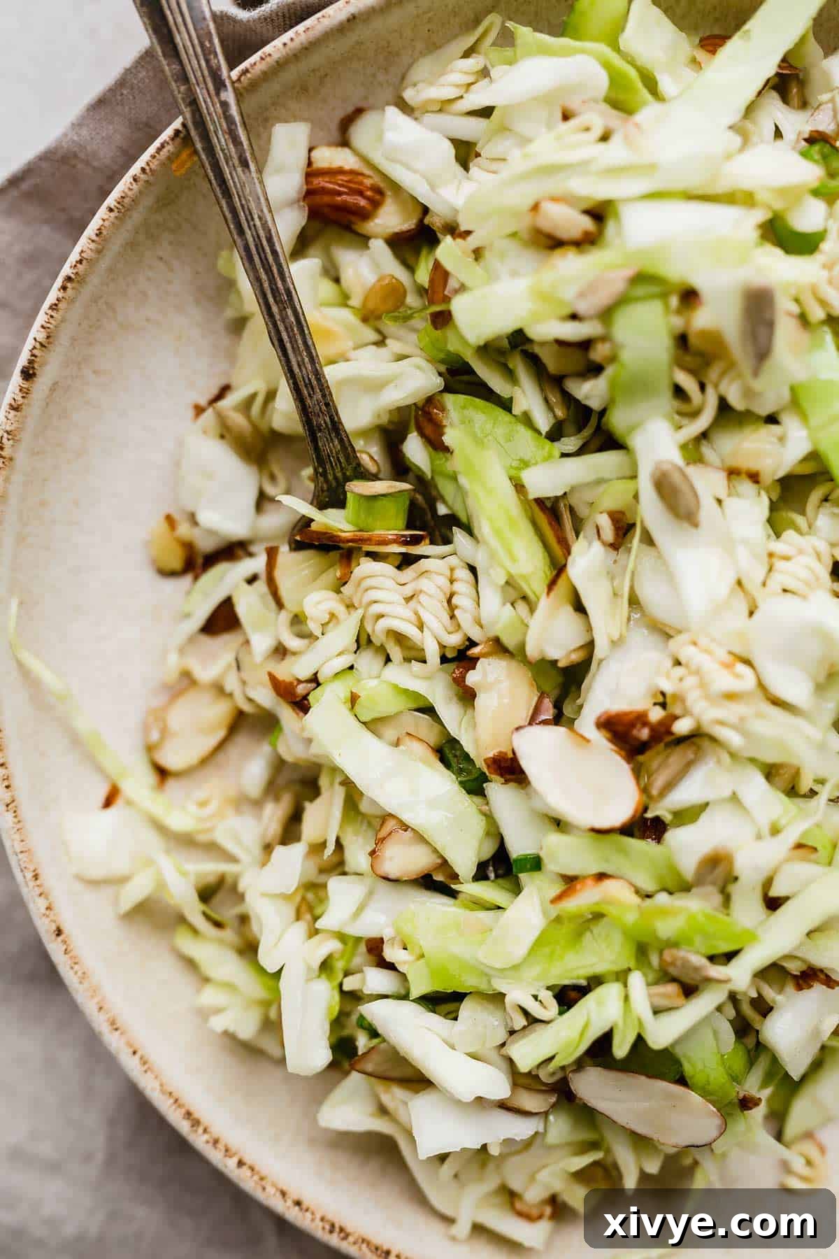 Close up photo of Crunchy Cabbage Salad with almonds and ramen.