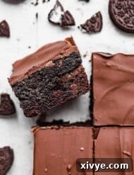 Decadent Oreo Truffle Brownies 7 An Oreo Truffle Brownie on a white background.