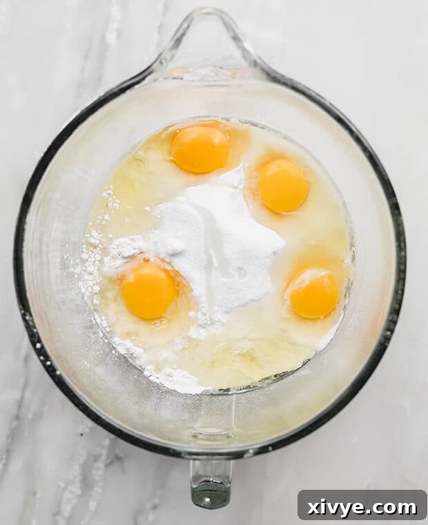 A glass bowl full of ingredients used to make Doughnut Dough.