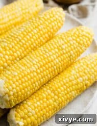 Sweet Boiled Corn on a white plate.
